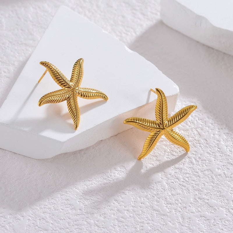 Pien – Ohrringe in Gold in Seesternform